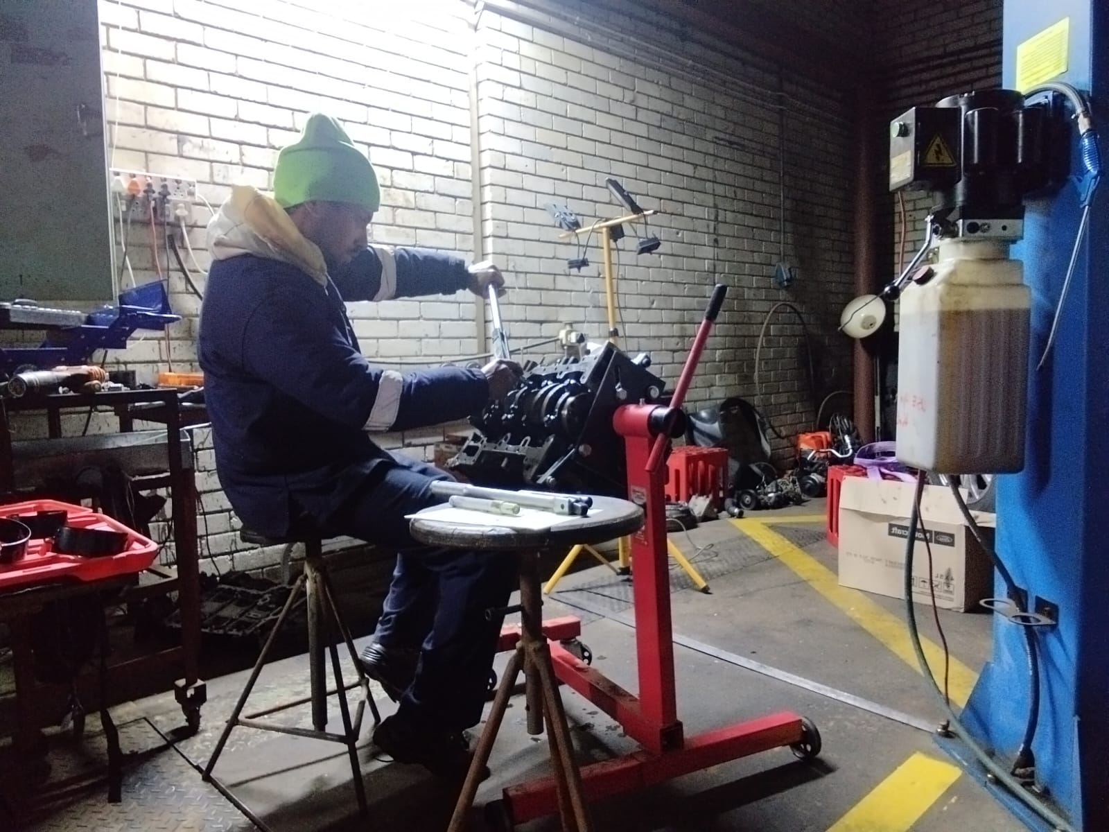 OJB Auto Repairs technician working on an engine